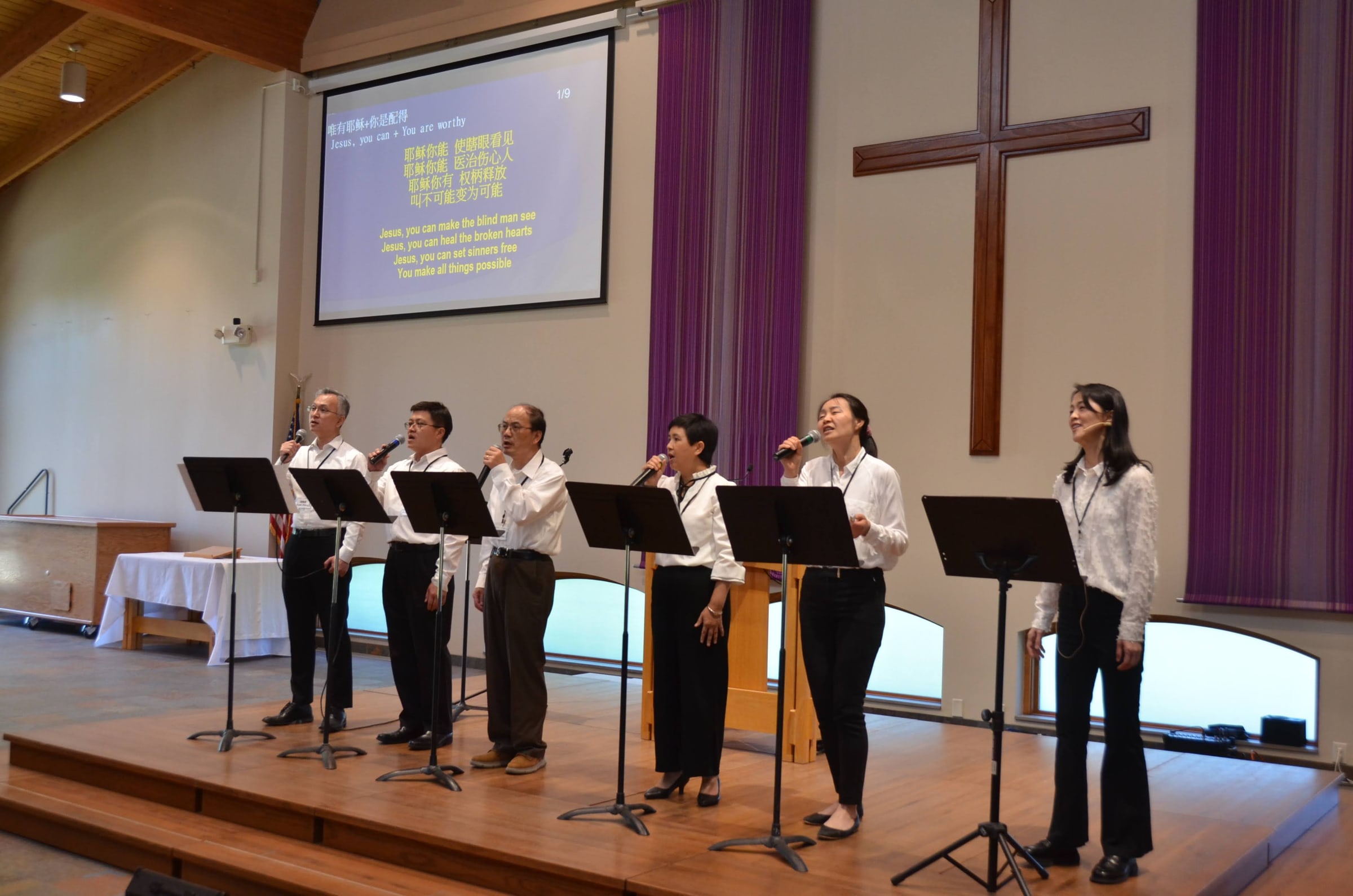Worship team singing on the sanctuary stage
